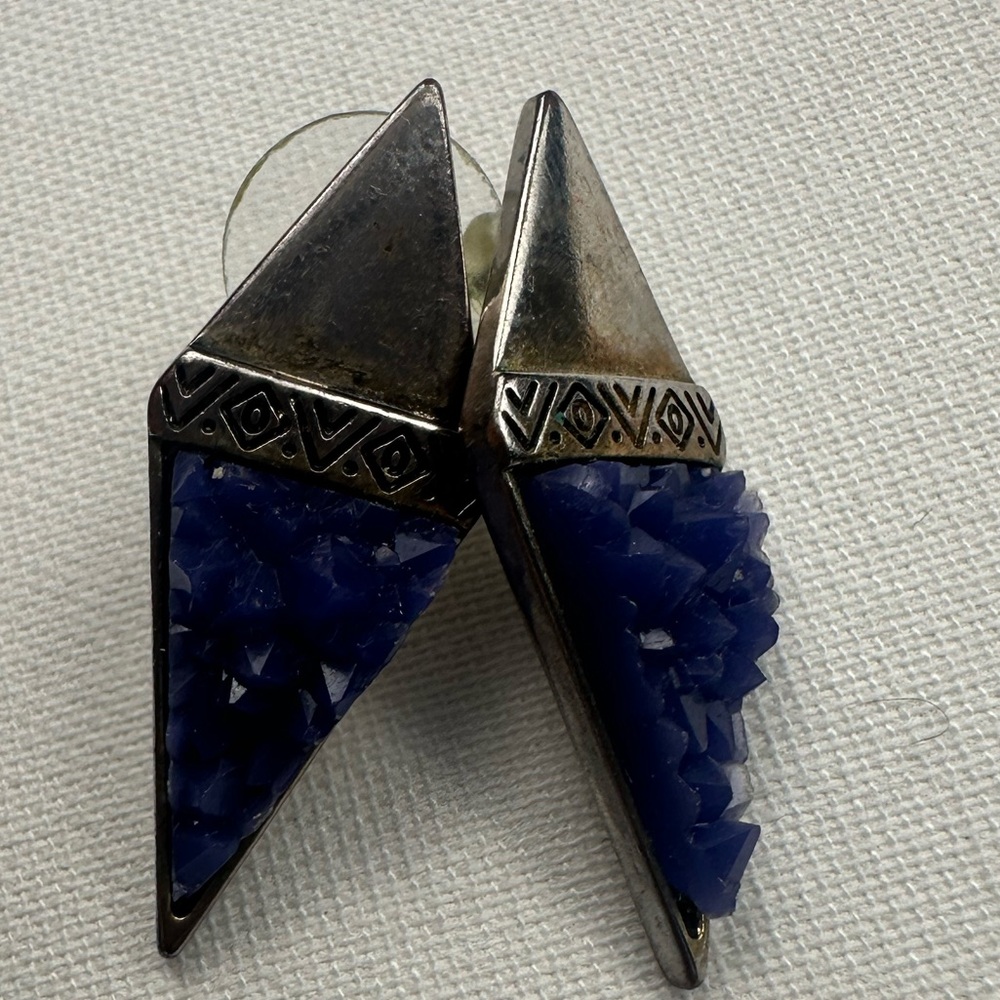 Large diamond shaped earrings with silver top and blue/purple gem like bottom.